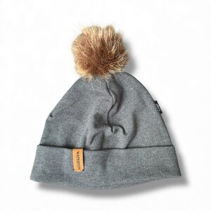 Eco-Friendly Ethica Waterton beanie with a faux fur pom-pom